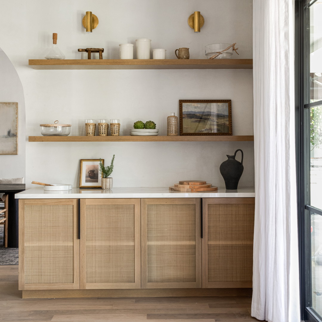 a kitchen with a lot of shelves on the wall