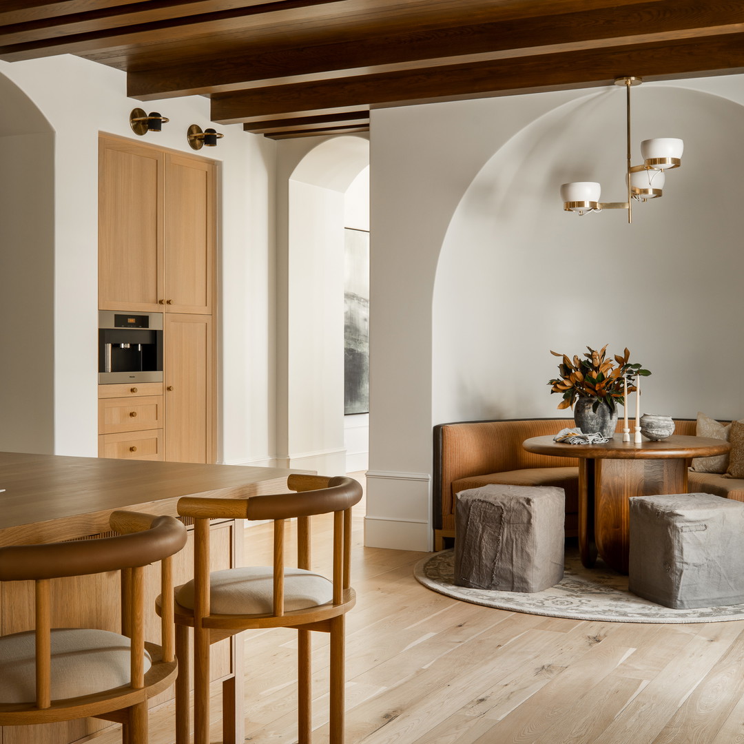 a dining room with a table and chairs