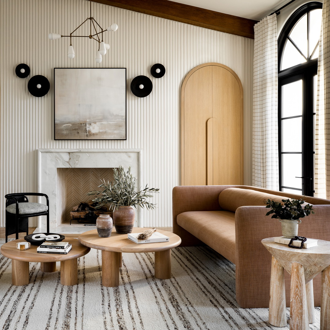 a living room filled with furniture and a fire place