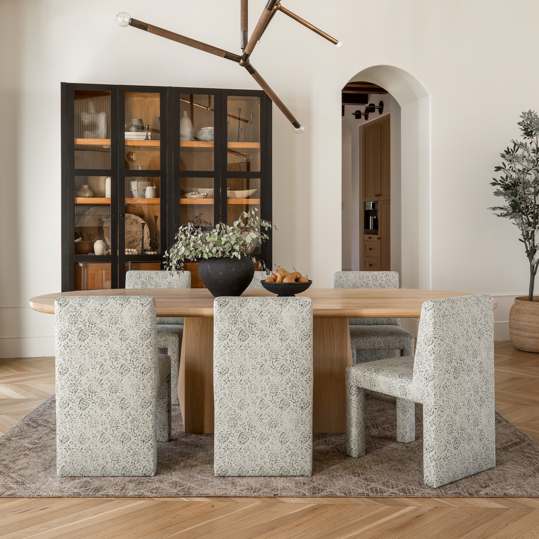 a dining room with a table and chairs