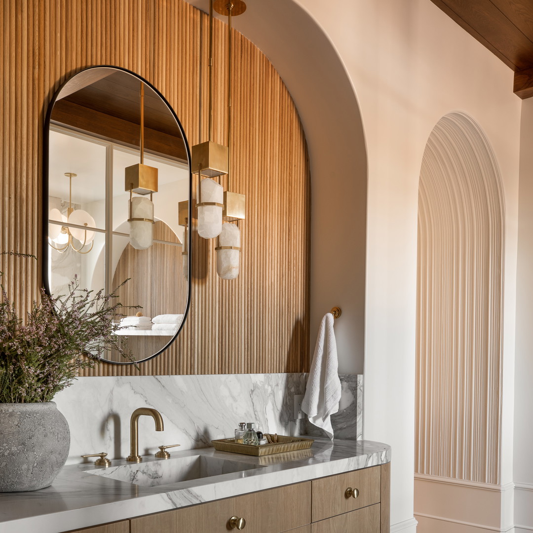 a bathroom with two sinks and a large mirror