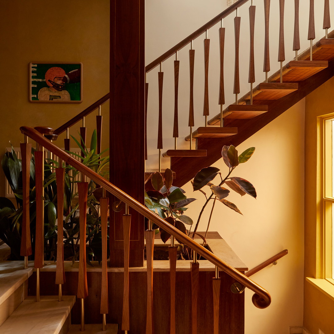 a stair case with a plant on the top of it