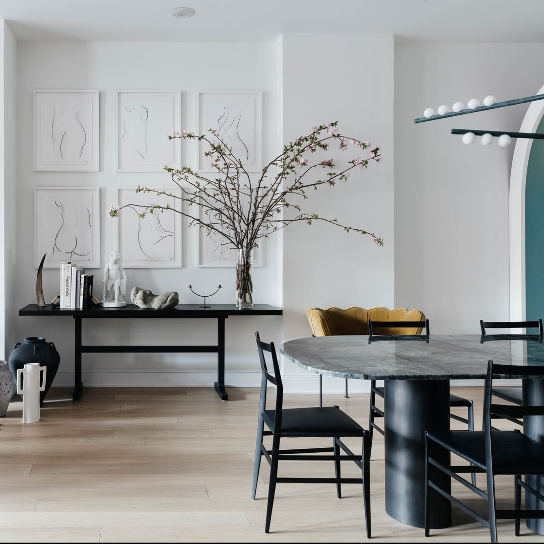 a dining room with a table and chairs