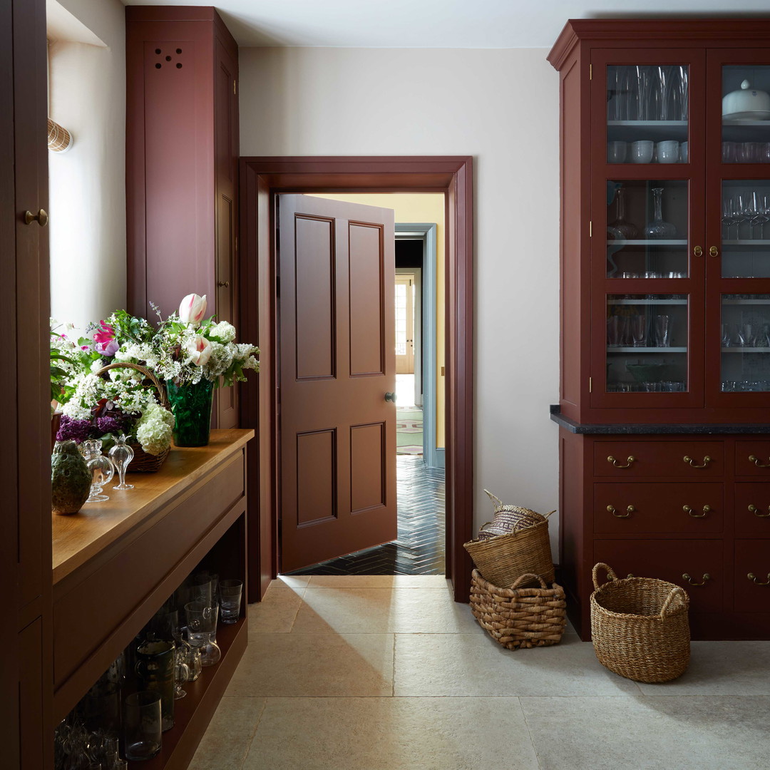 a hallway leading to a dining room and kitchen