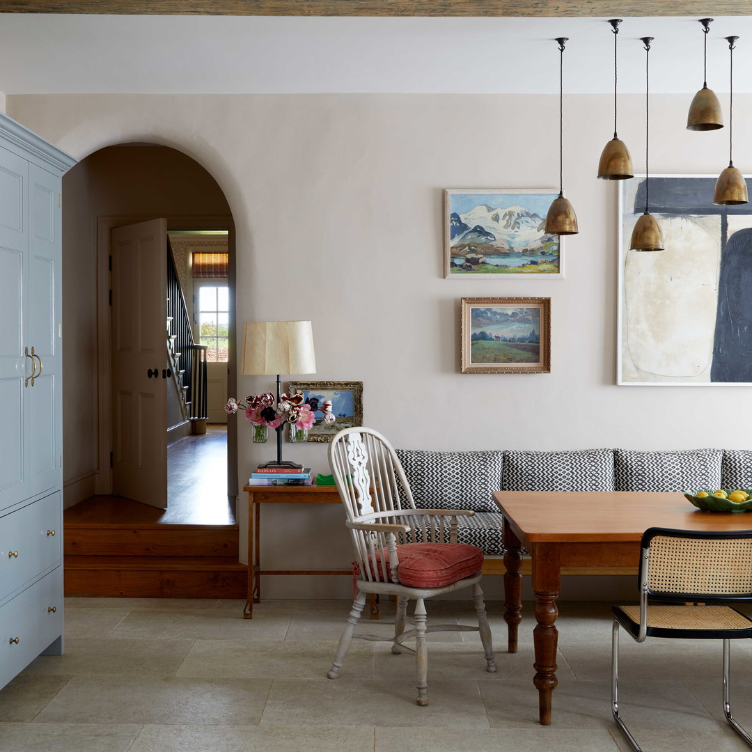 a living room with a couch a table and chairs