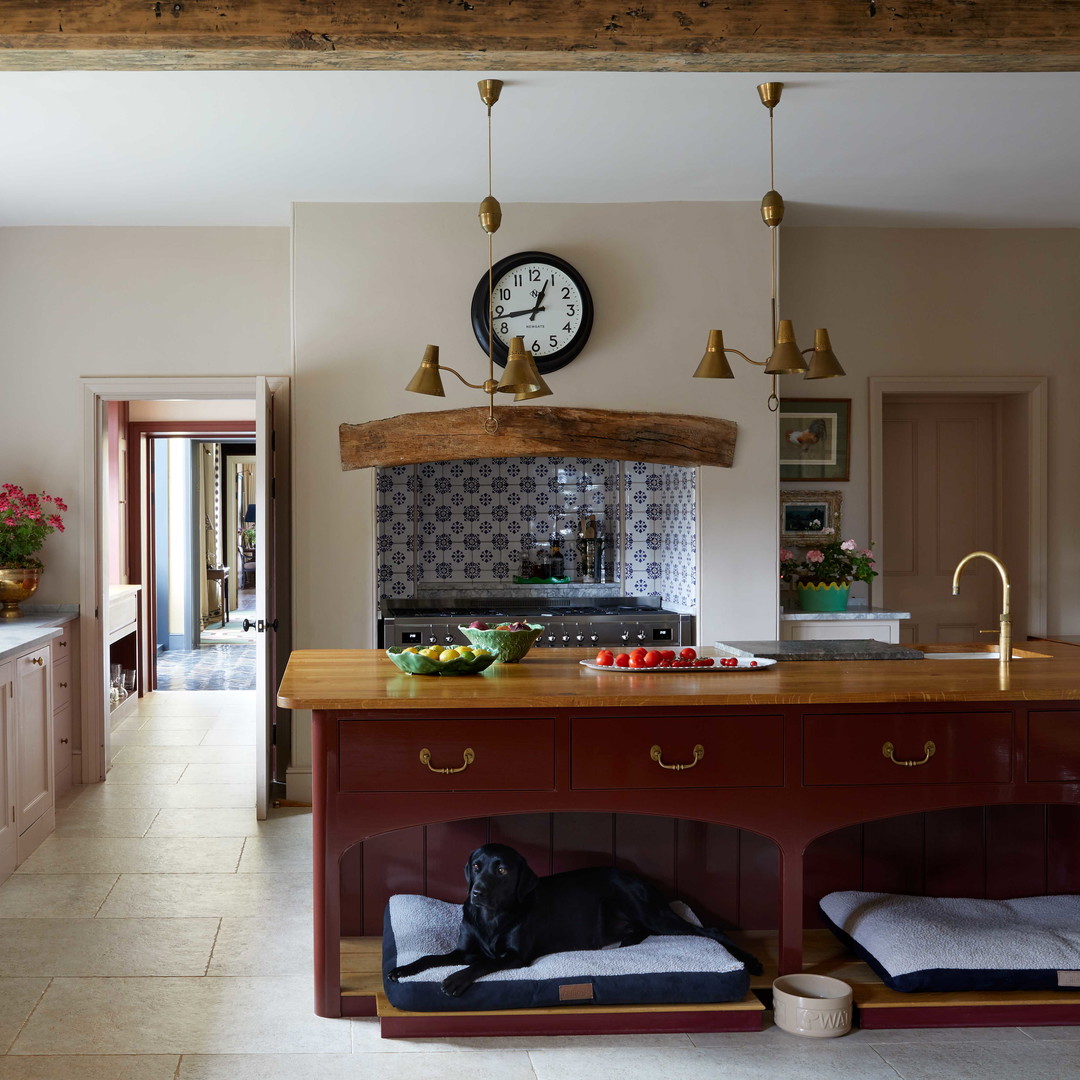 a kitchen with a clock on the wall