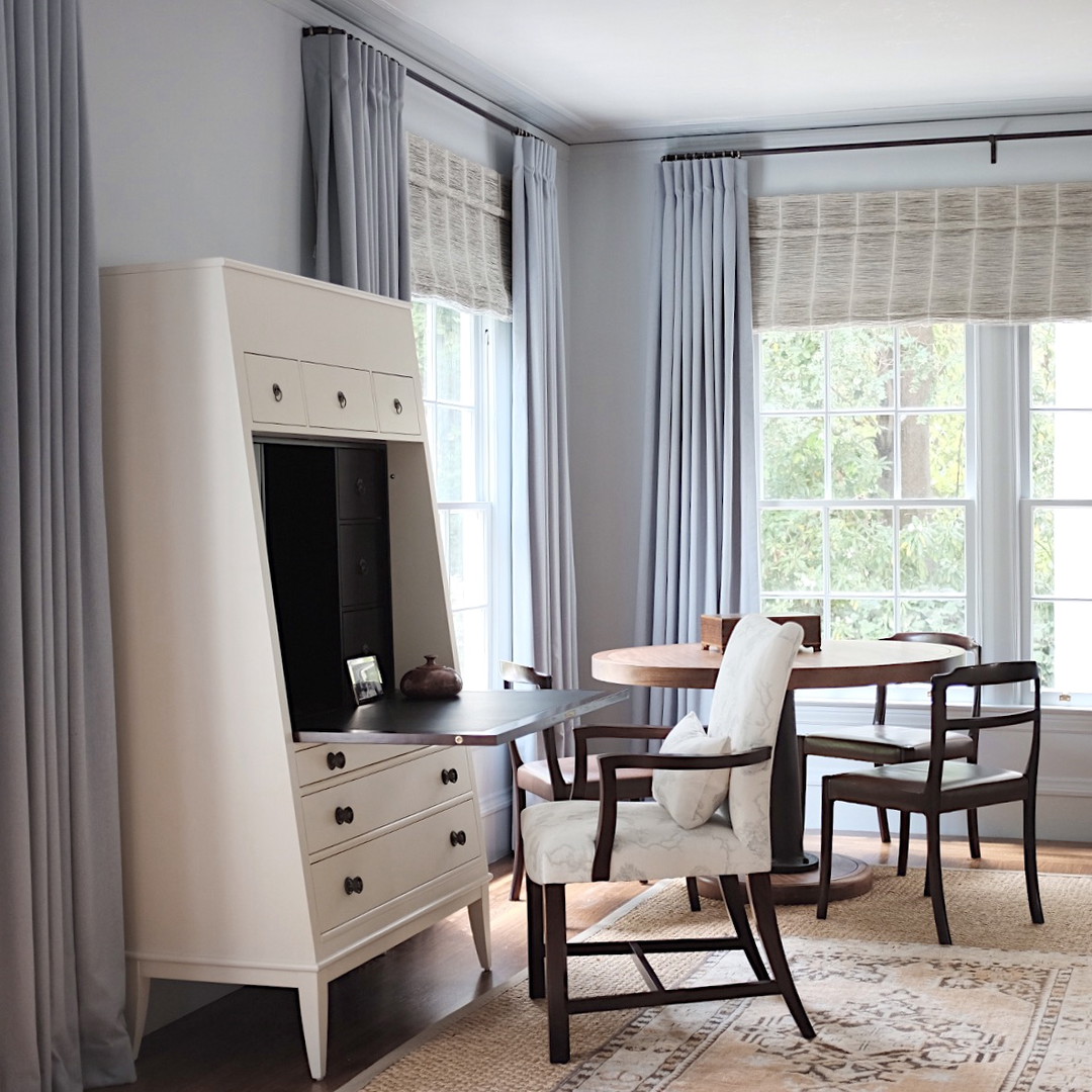 a living room filled with furniture and a flat screen tv