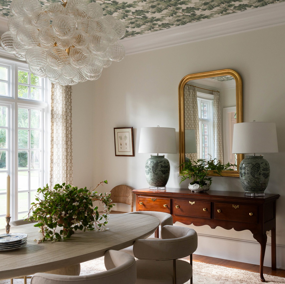 a dining room with a table and chairs