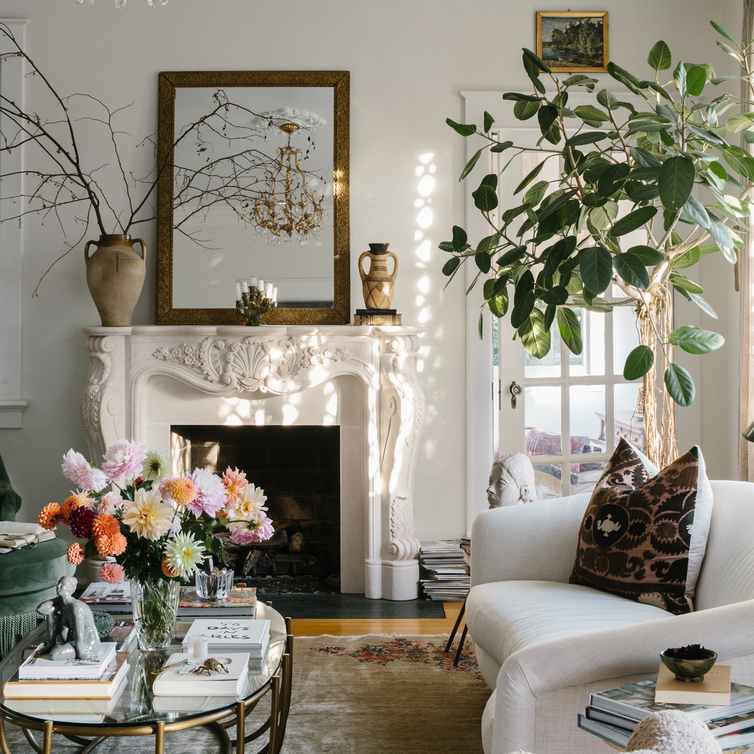 a living room filled with furniture and a fire place