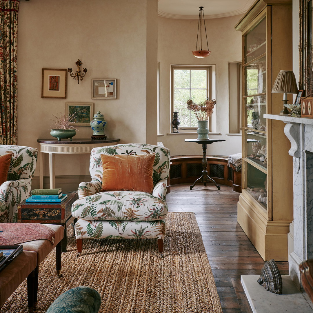 a living room filled with furniture and a fire place