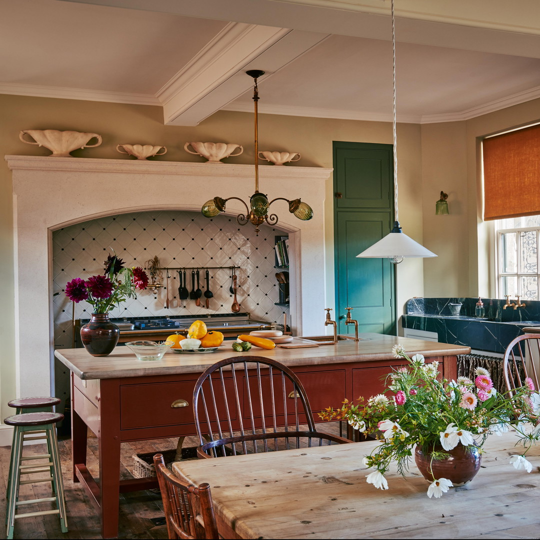 a kitchen with a table, chairs and a stove