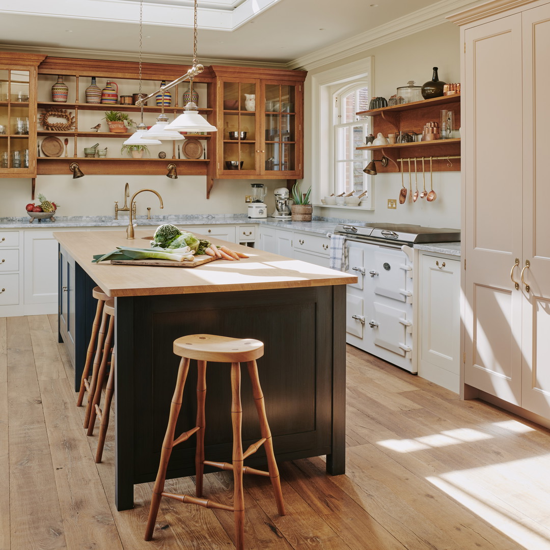 a kitchen with a center island with stools