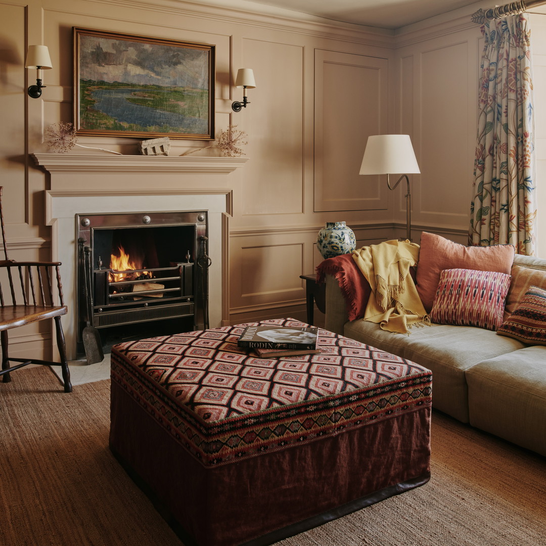 a living room filled with furniture and a fire place