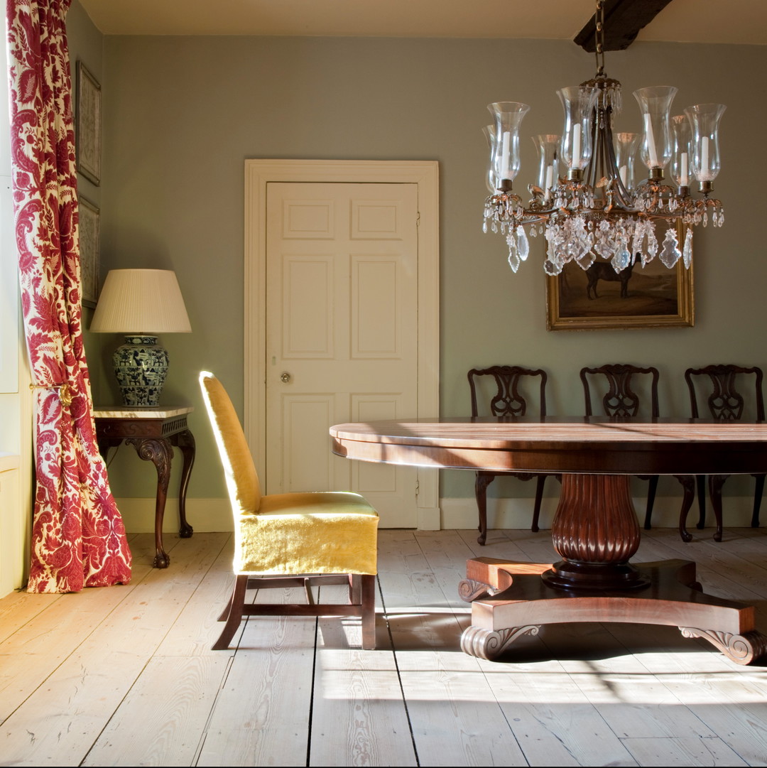 a dining room with a chandelier and a table