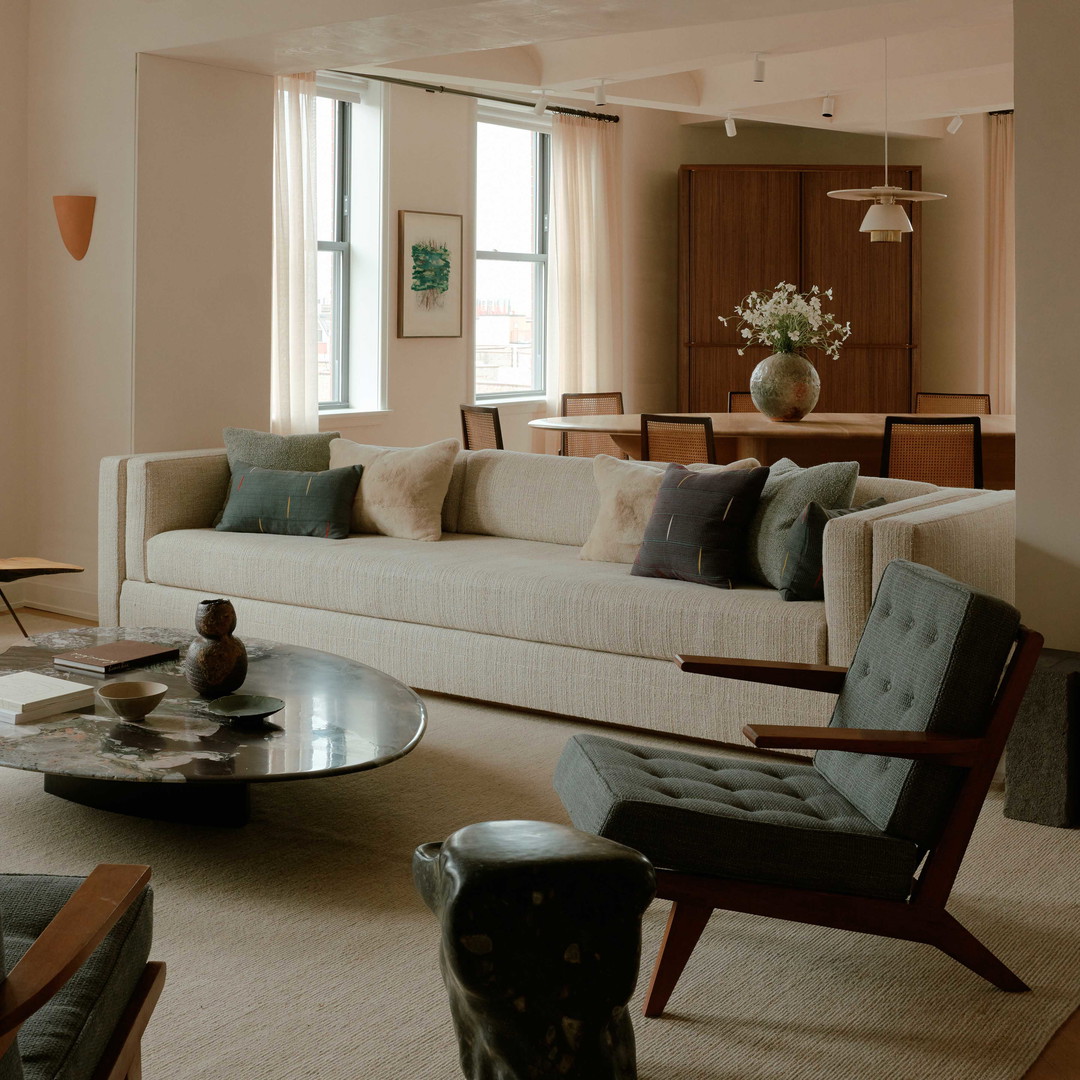 a living room filled with furniture and a large window