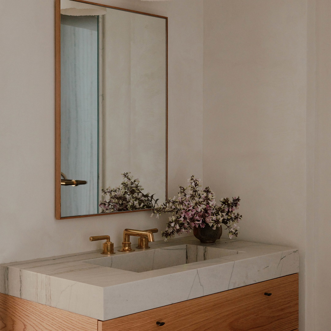 a bathroom with a sink and a mirror