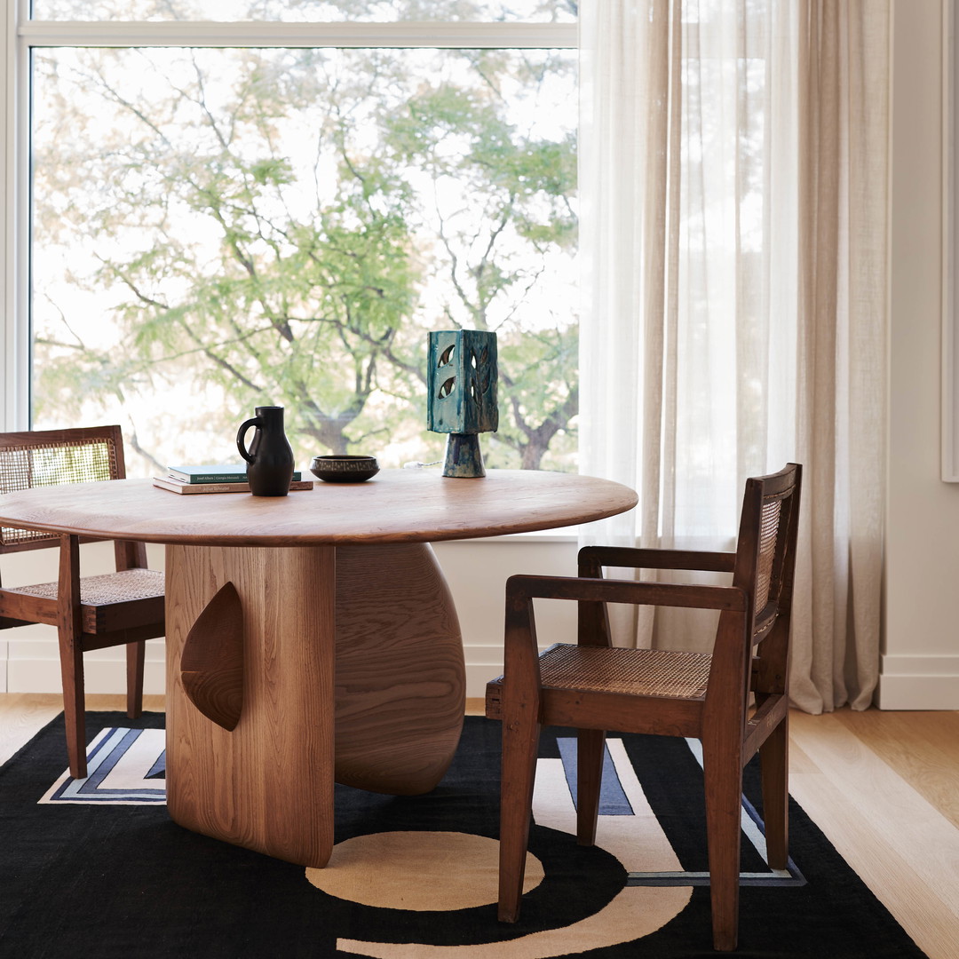 a dining room table with chairs around it