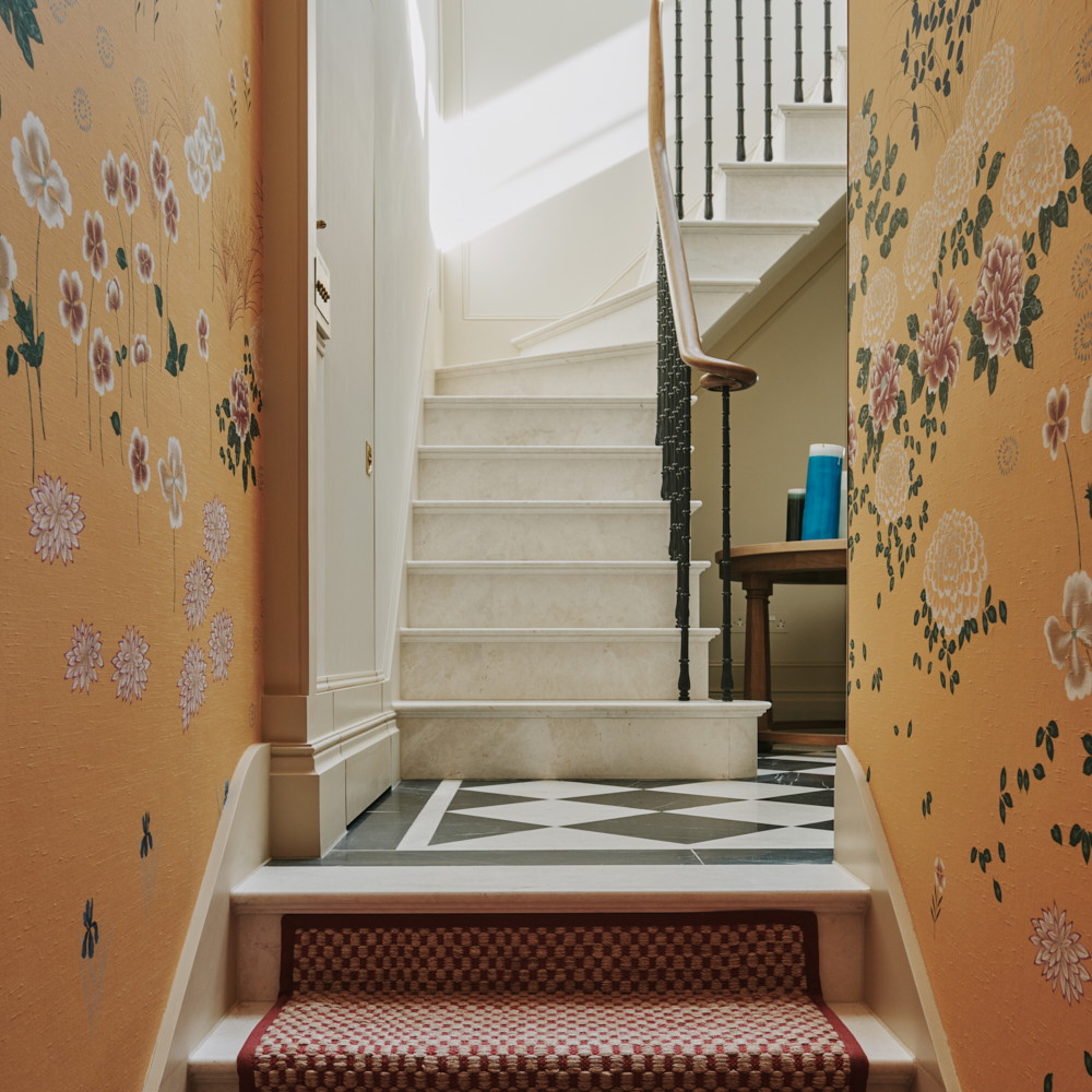 a stair case with flowers painted on it