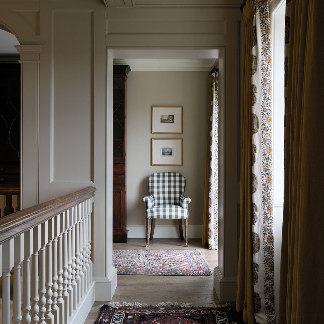 a chair sitting on top of a rug next to a doorway