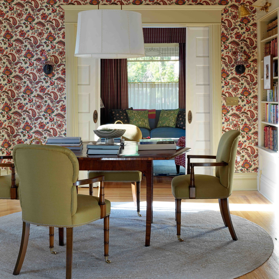 a dining room with a table and chairs