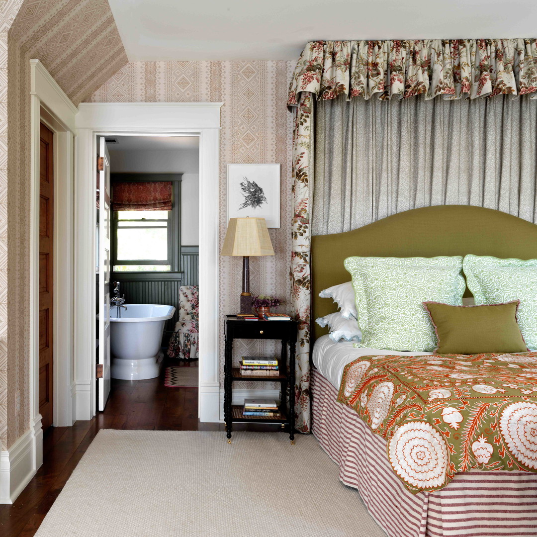 a bed sitting in a bedroom next to a doorway