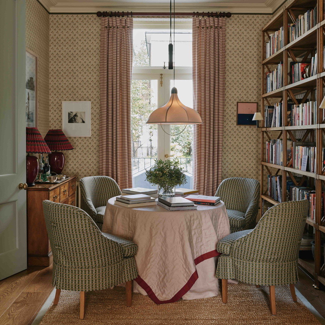 a dining room with a table and chairs