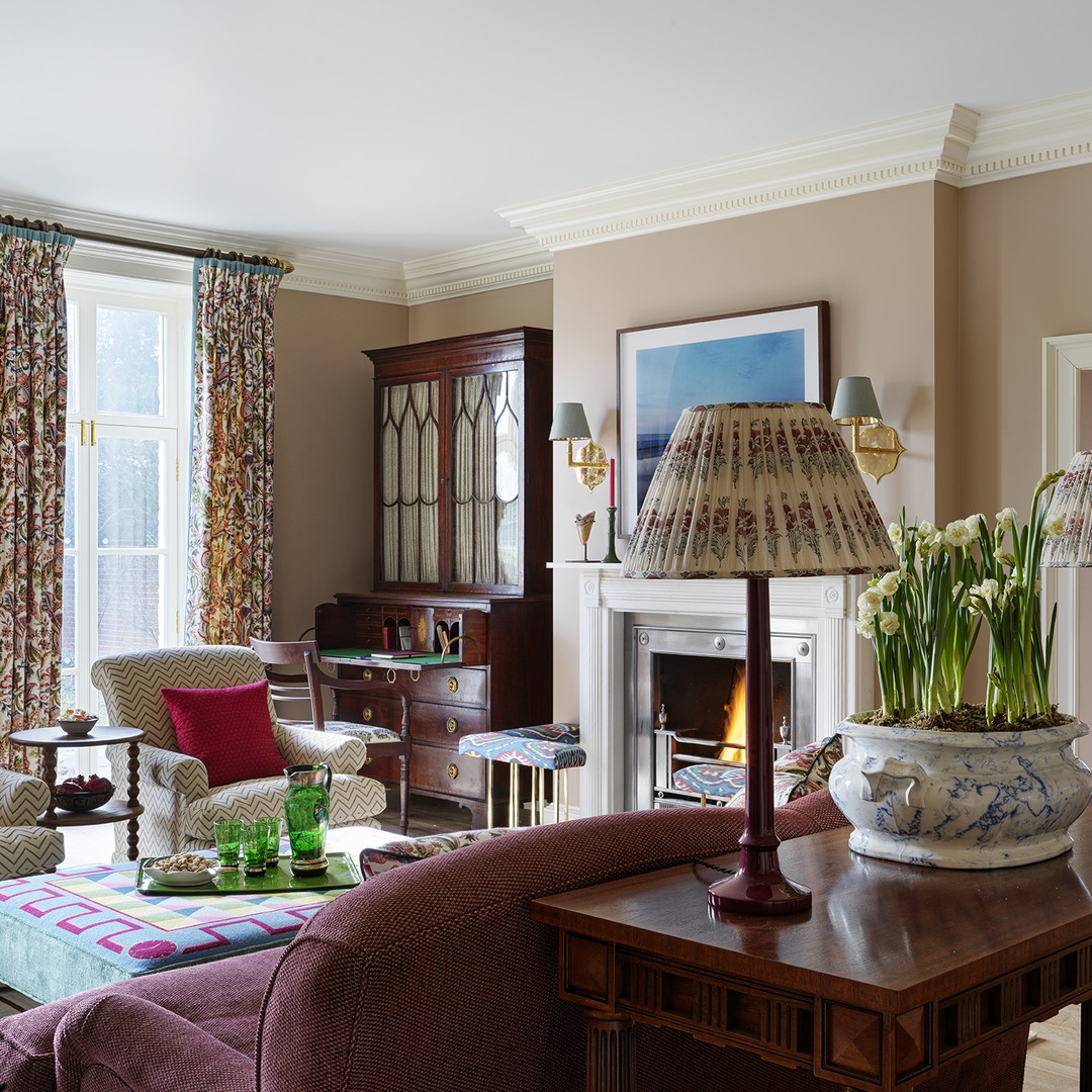 a living room filled with furniture and a fire place