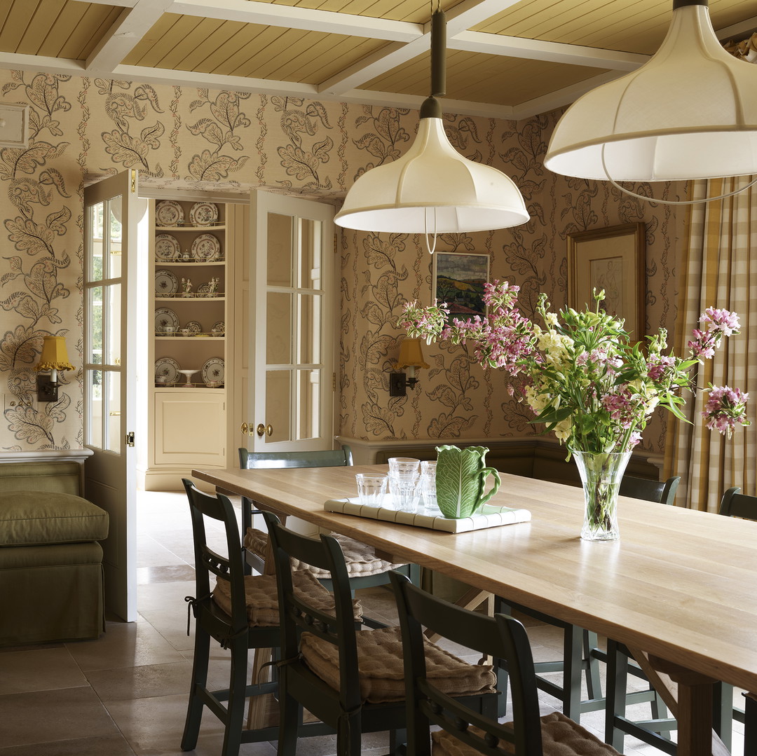 a dining room table with chairs and a couch