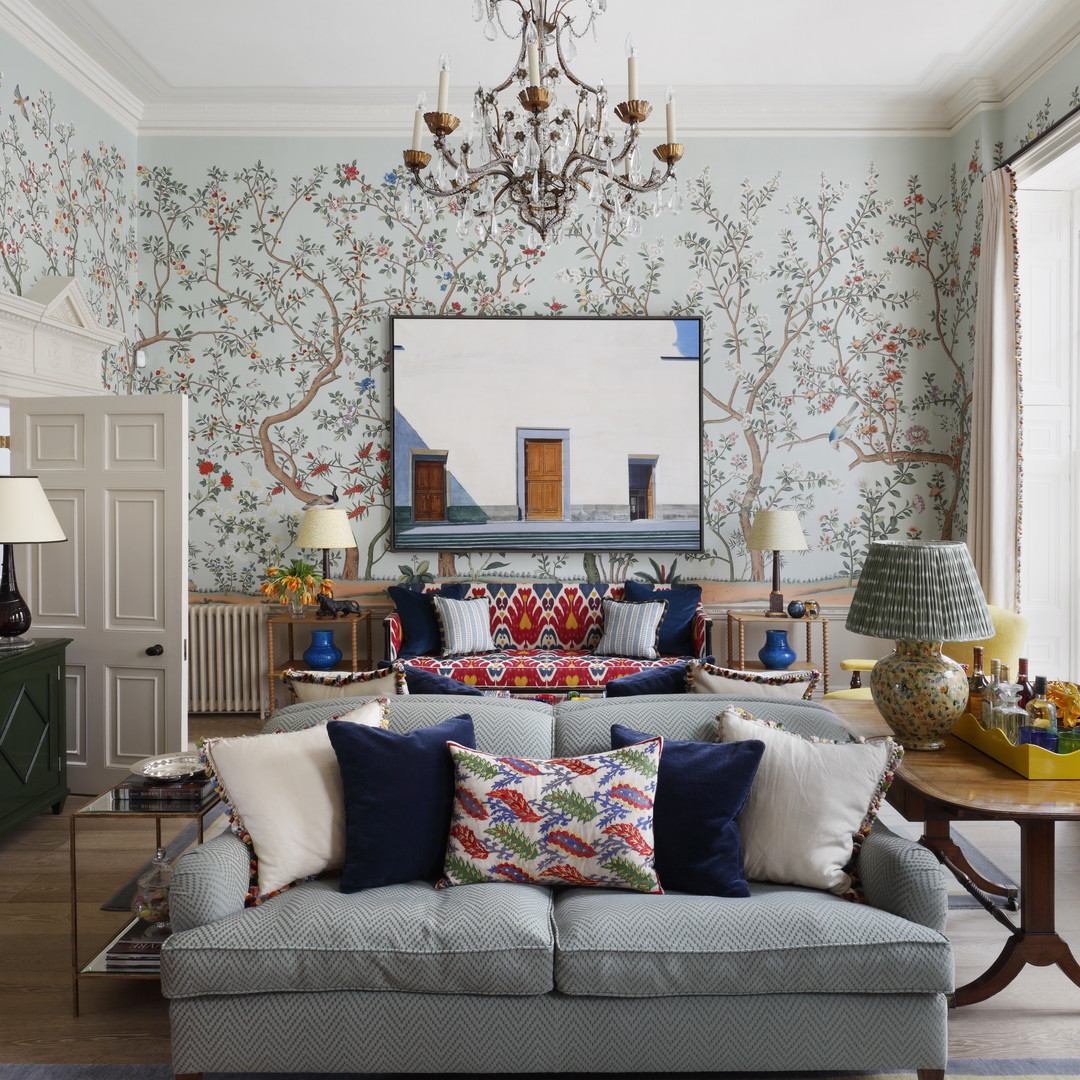 a living room filled with furniture and a chandelier