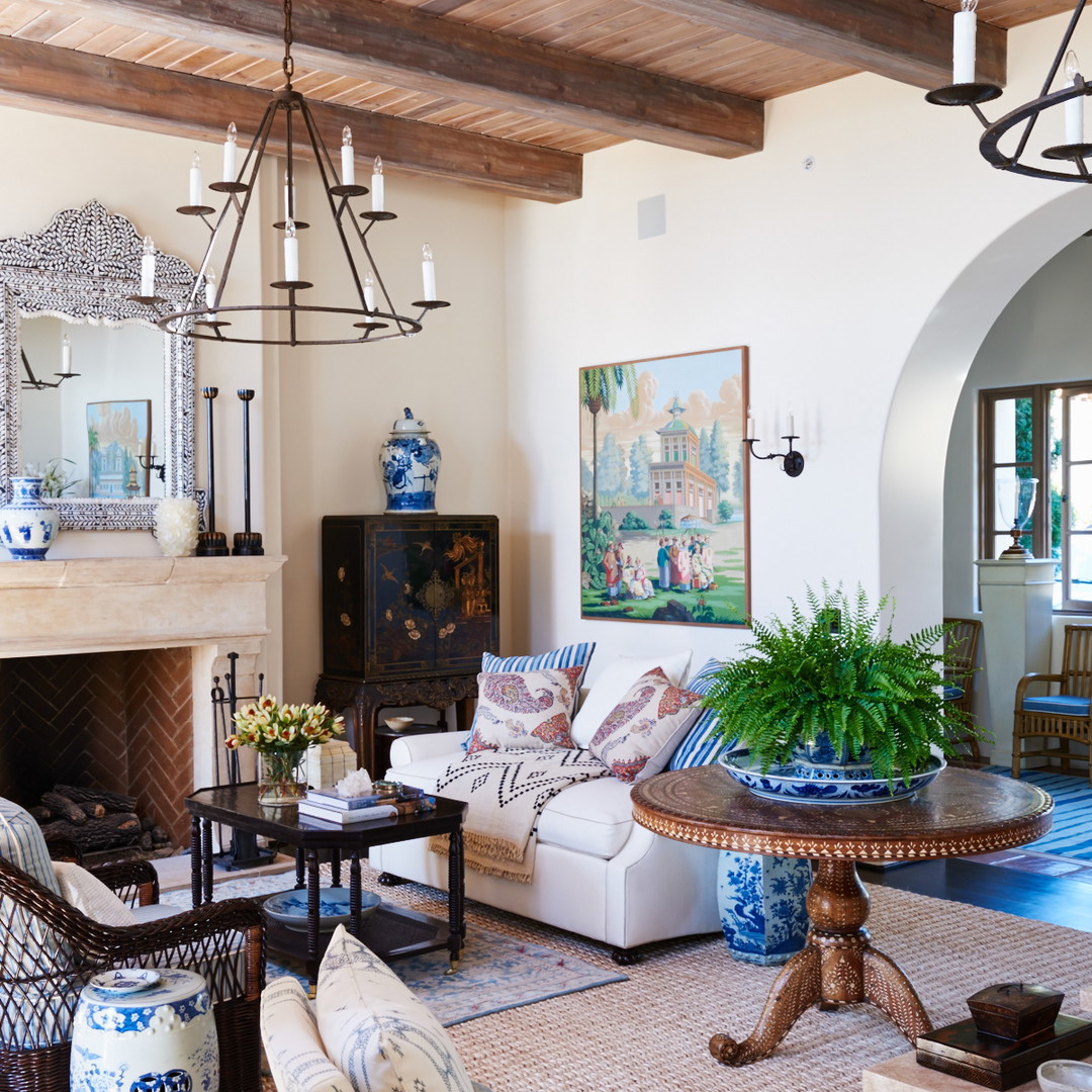 a living room filled with furniture and a fire place