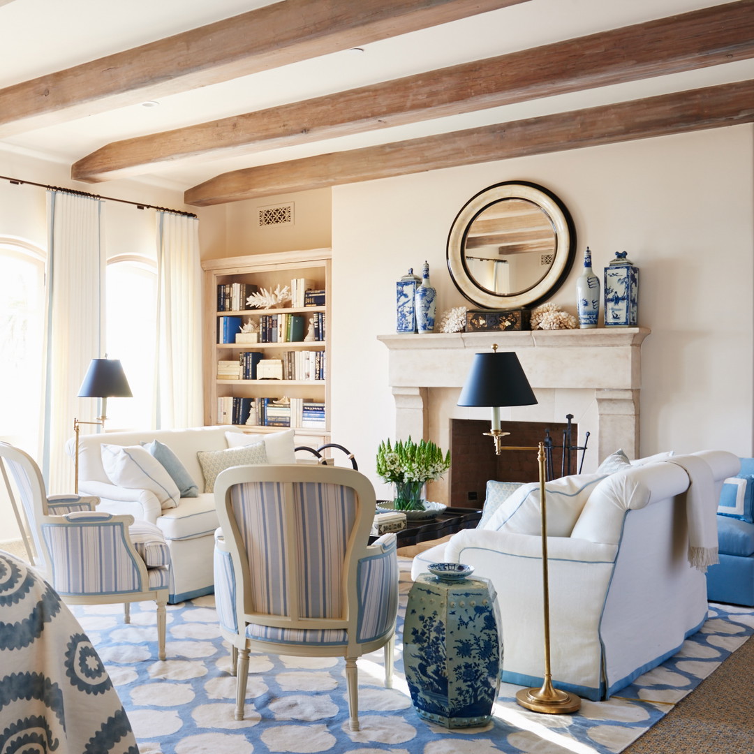 a living room filled with furniture and a fire place