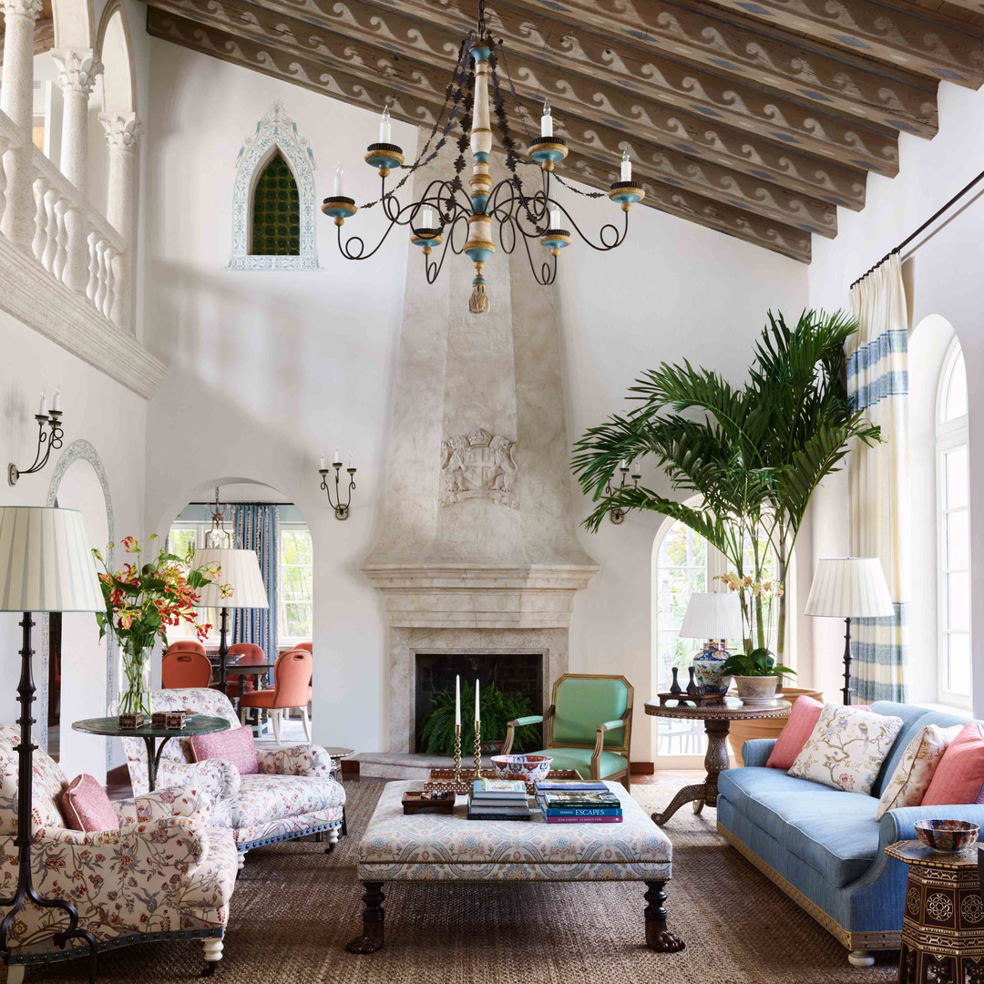 a living room filled with furniture and a fire place