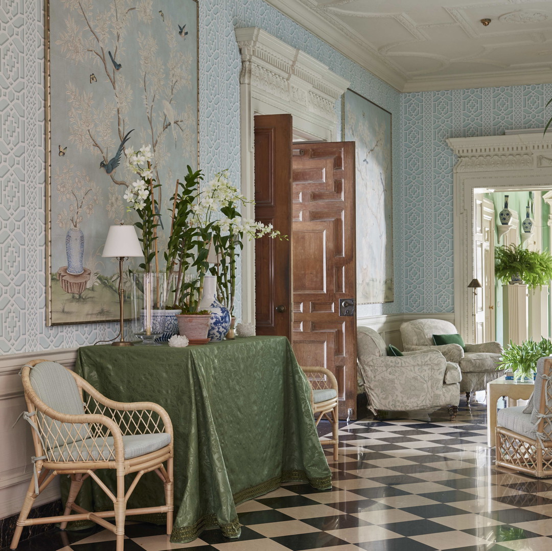 a living room filled with furniture and a checkered floor