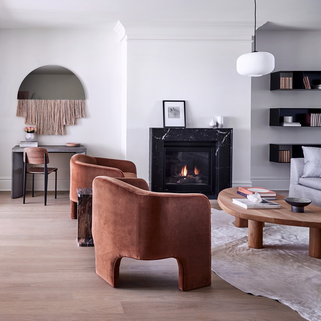 a living room filled with furniture and a fire place