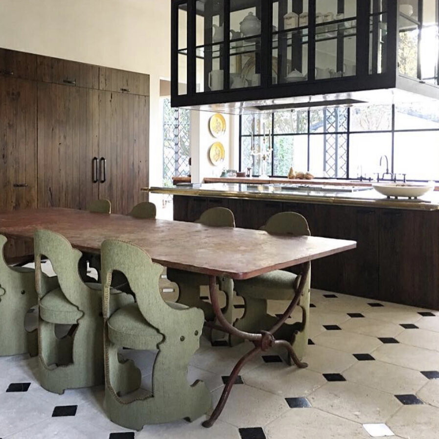 a kitchen with a table and chairs in it