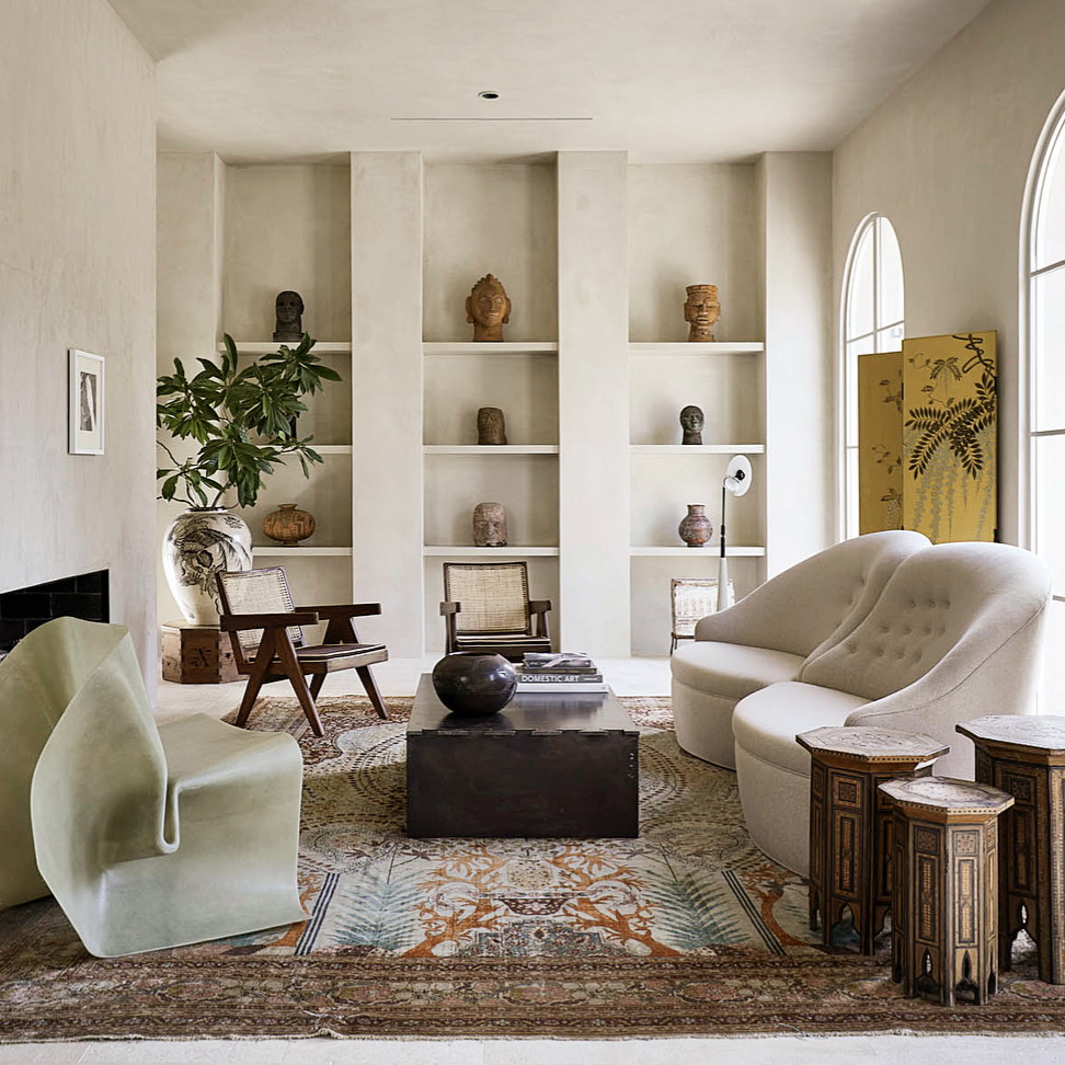 a living room filled with furniture and a fire place