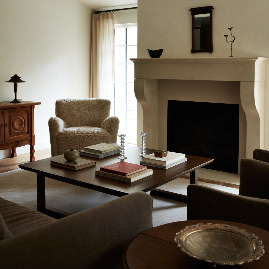 a living room filled with furniture and a fire place