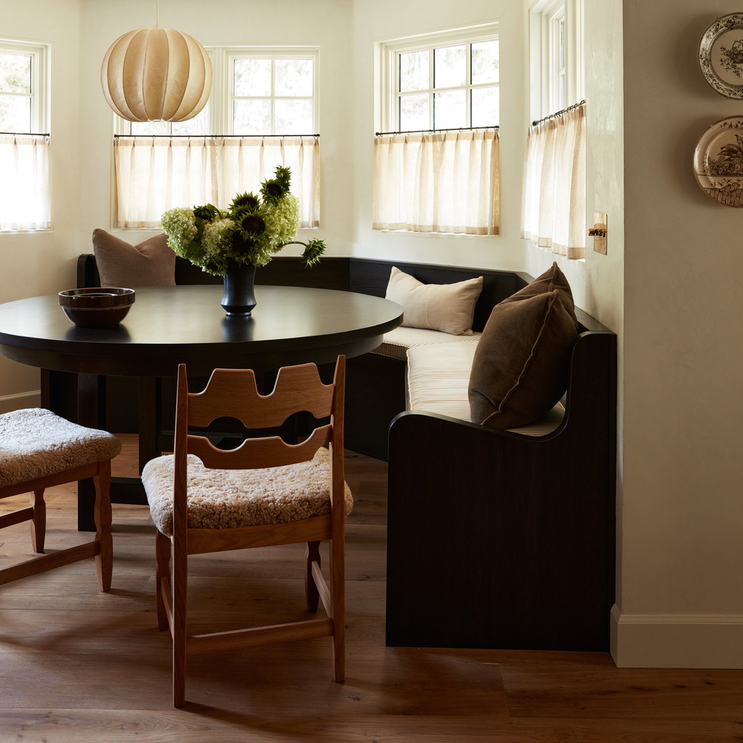 a room with a table, chairs, and a couch