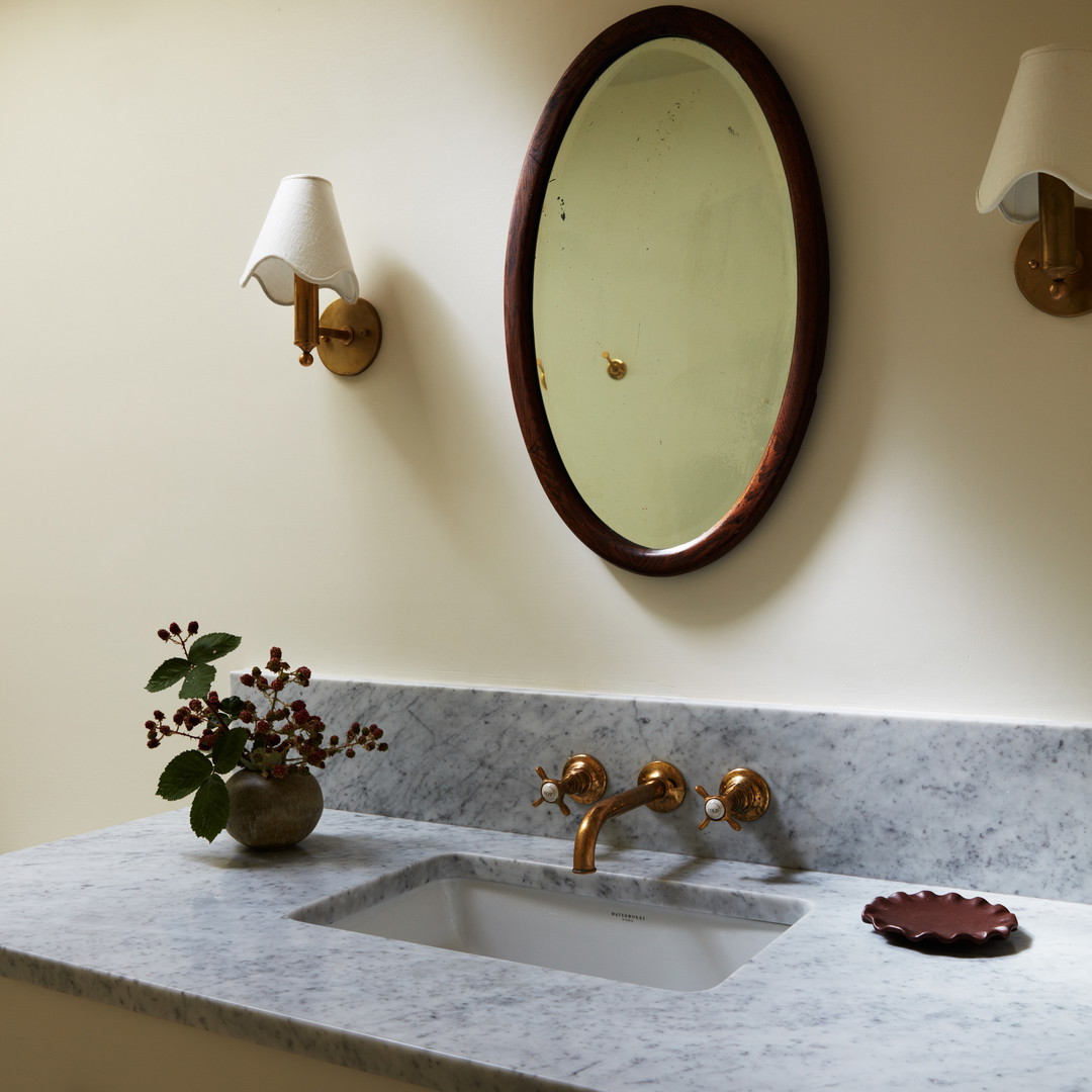 a bathroom sink with a mirror above it