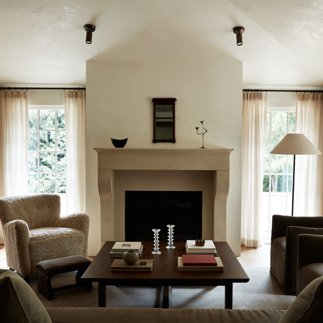 a living room filled with furniture and a fire place