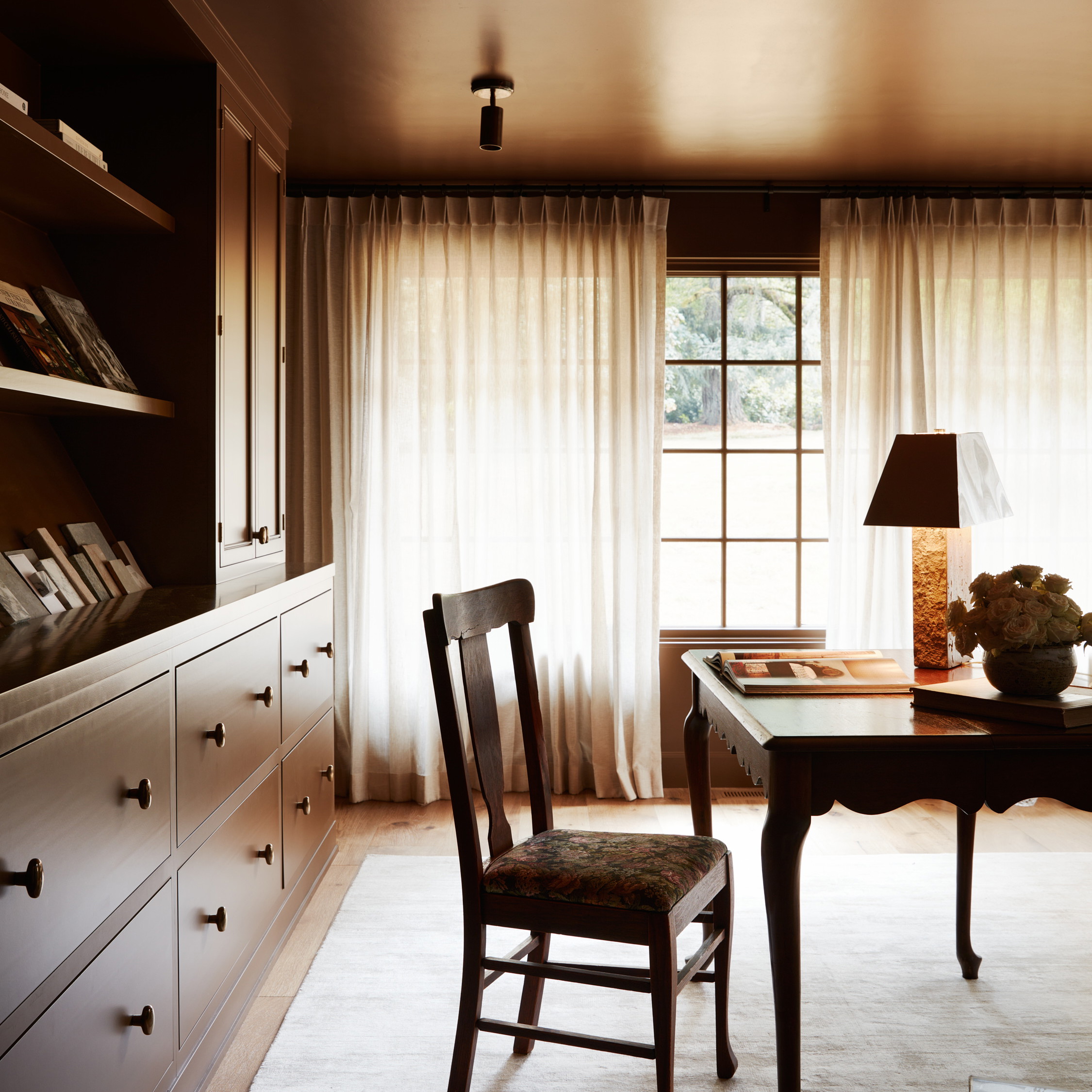 a room with a desk and a chair in it