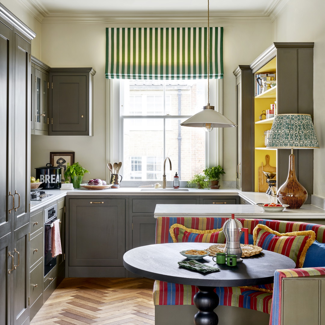 a kitchen with a table and chairs in it