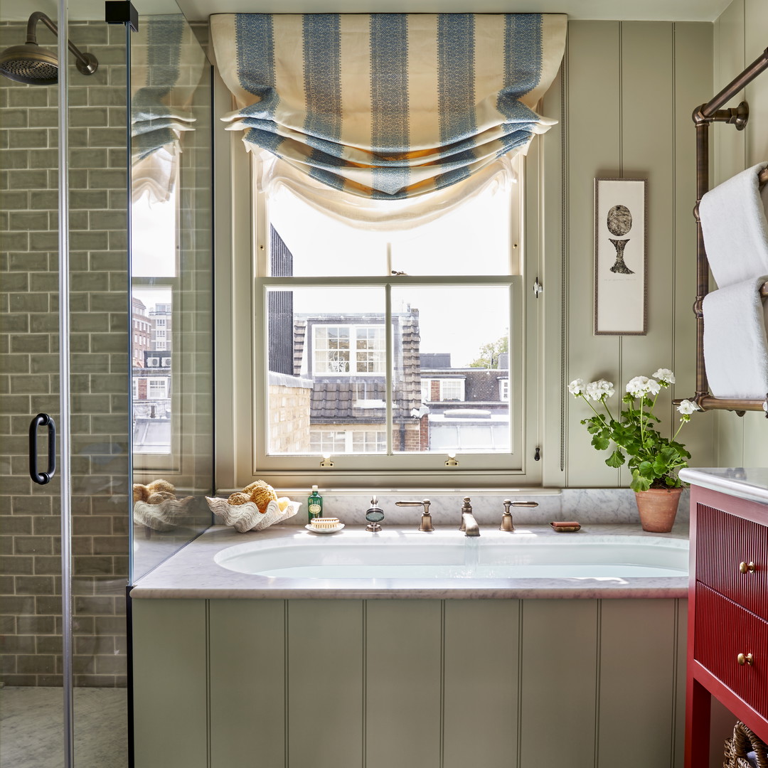 a bathroom with a large tub and a window