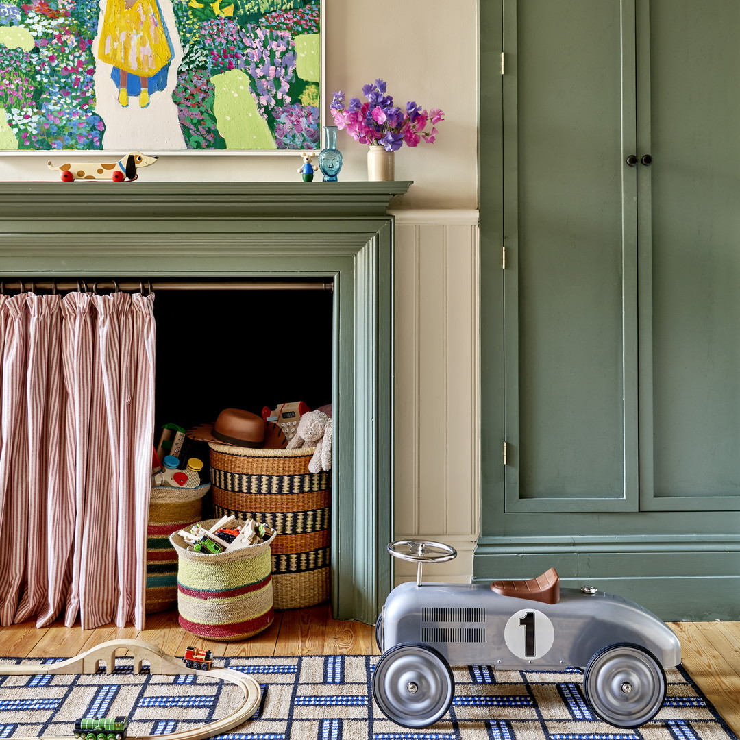 a child's room with a toy car on the floor