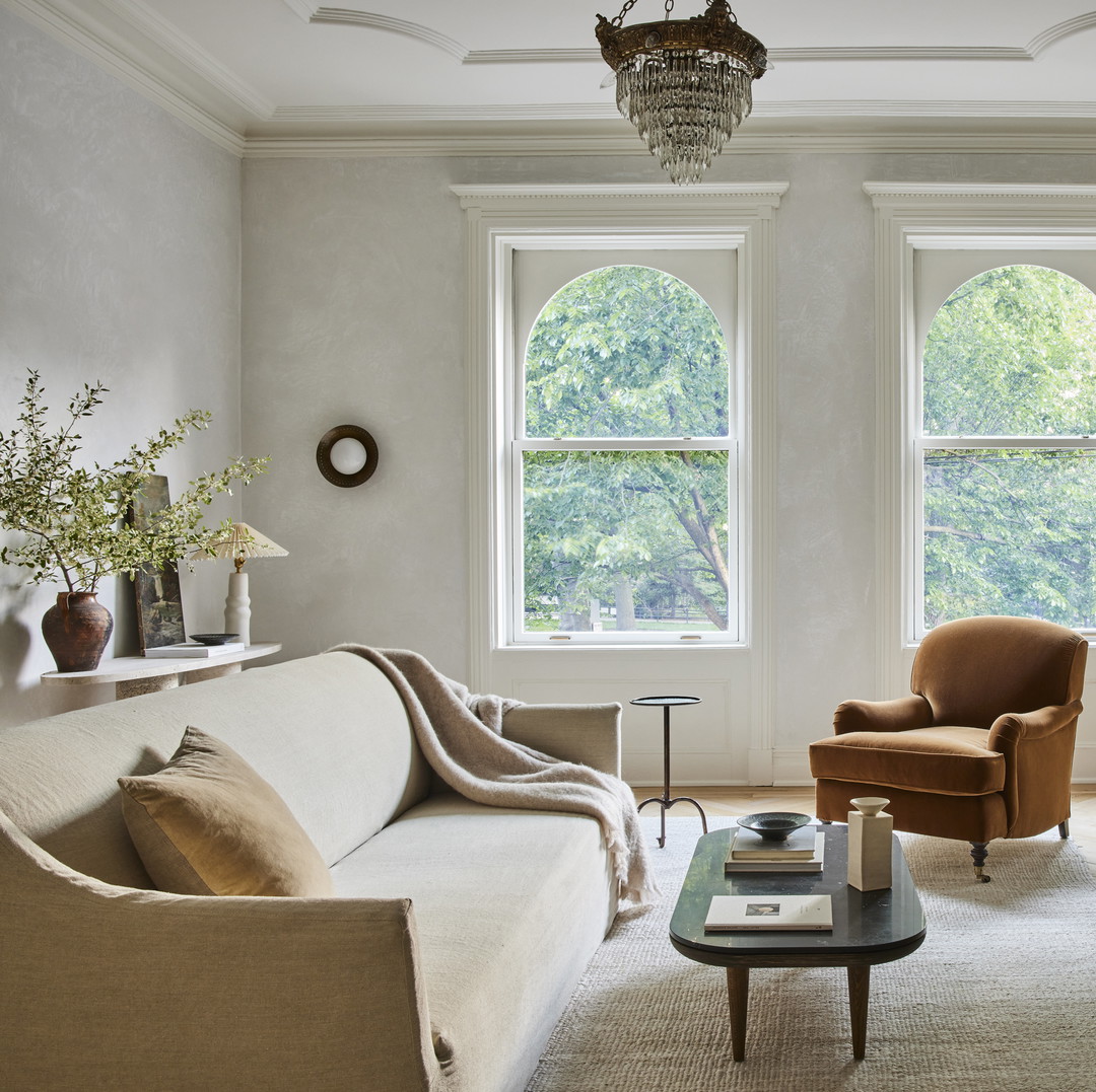 a living room filled with furniture and a fire place