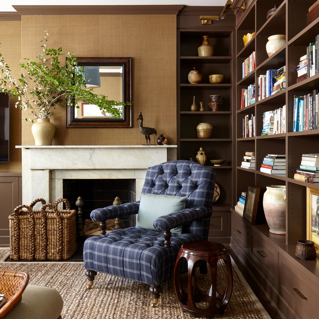 a living room filled with furniture and a fire place