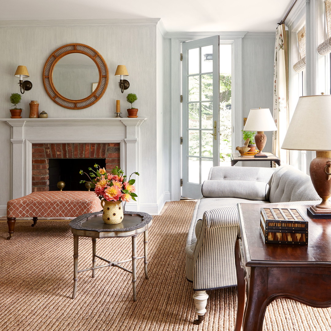 a living room filled with furniture and a fire place