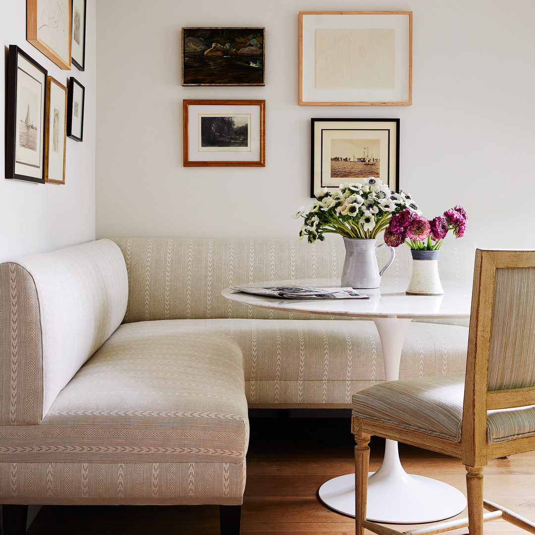 a living room with a white couch and a table