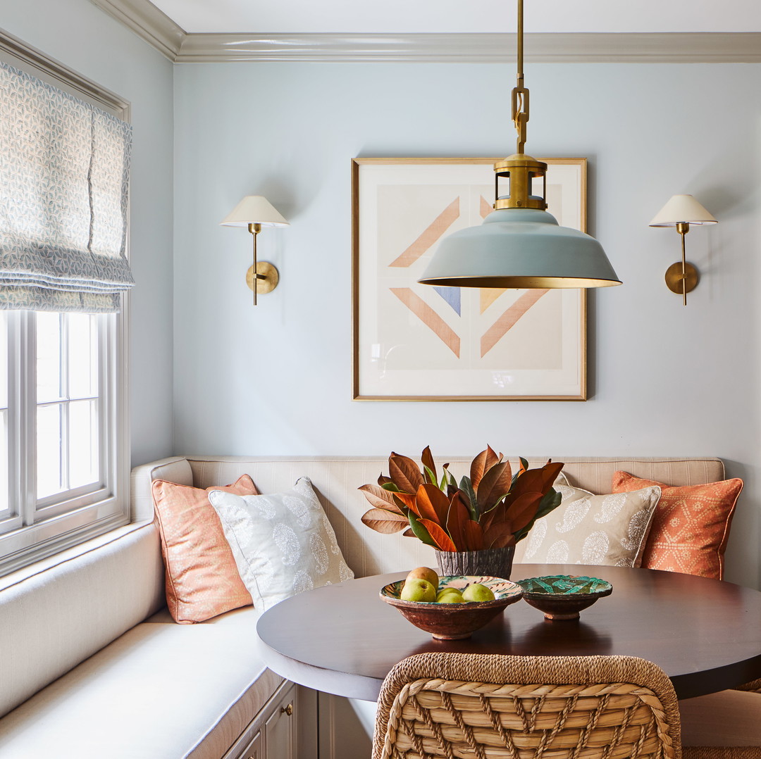 a dining room with a table and chairs