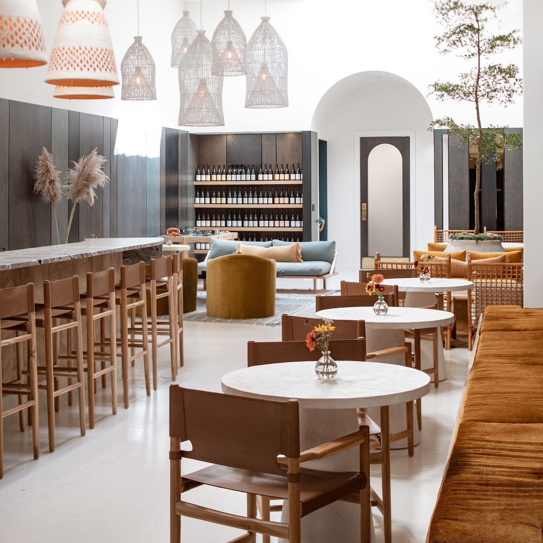 a restaurant filled with lots of tables and chairs